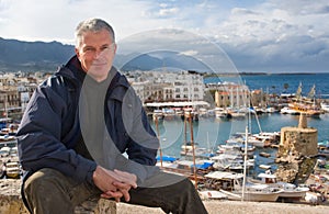 Elderly man against the port of Kyrenia