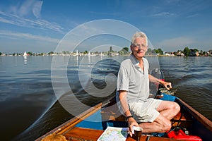 Elderly man in boat photo