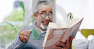 Elderly man, book and coffee on sofa with smile, reading or relax in retirement in home living room. Senior african