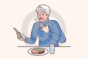 Elderly man choked eating and coughed needing help and blushing feeling lack of air.