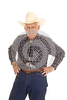 Elderly man cowboy pistol in pants