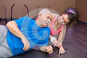 elderly man doing side plank