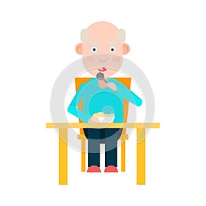 Elderly man eat at the table