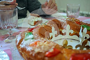 elderly man eating Epiphany cake or Roncon de Reyes