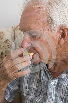 Elderly Man Eating Shortbread.