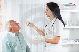 Elderly man examined by an ophthalmologist