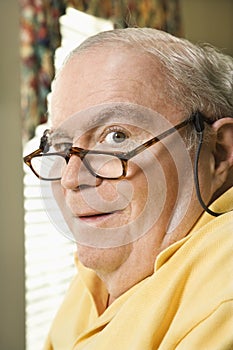 Elderly man with glasses.