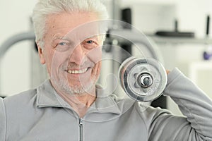 Elderly man in a gym