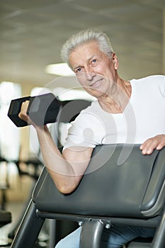 Elderly man in a gym during exercise