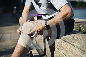 Elderly man having a knee injury