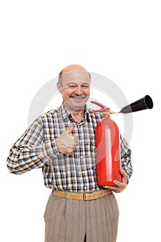 Elderly man is holding a red fire extinguisher.