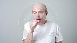 Elderly man is ill from colds or pneumonia.