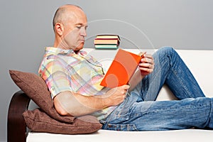 Elderly man with interesting book