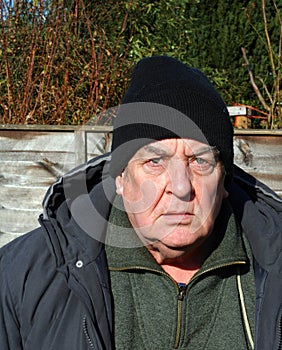 Elderly man looking annoyed