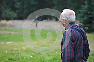 Elderly man looking off