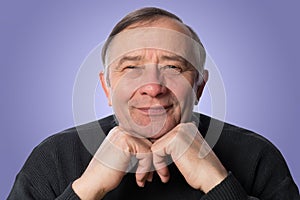 An elderly man with looks skeptically