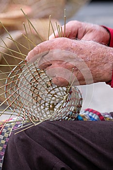 Elderly man makes baskets for use in the fishing industry in the traditional way, in Gallipoli, Puglia, Italy.