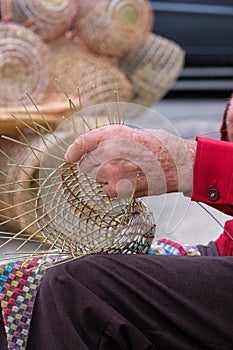 Elderly man makes baskets for use in the fishing industry in the traditional way, in Gallipoli, Puglia, Italy.