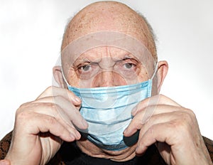 Elderly man in a medical mask