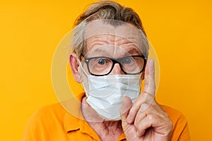 elderly man medical mask on the face protection close-up  background