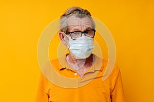 elderly man medical mask on the face protection close-up isolated background