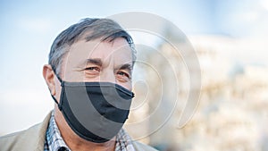 Elderly man in a medical mask. He has the flu. Protecting people around you from the virus. concept of a pandemic