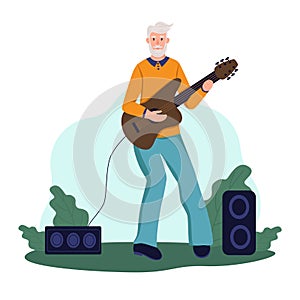 An elderly man plays guitar in a Park