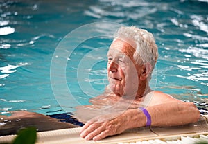 Elderly man in pool