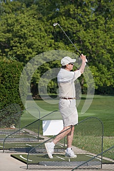 Elderly Man Practicing Golf