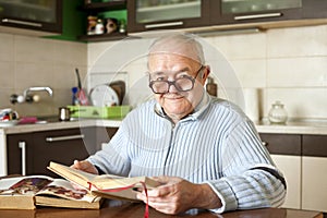 Elderly man reading a book