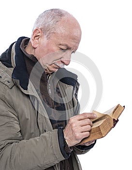 Elderly man reading holy bible