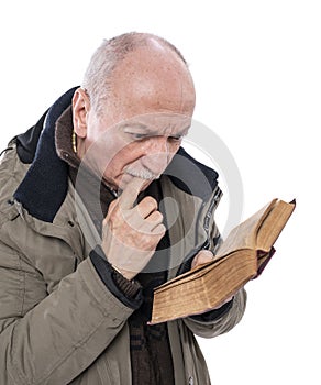 Elderly man reading holy bible