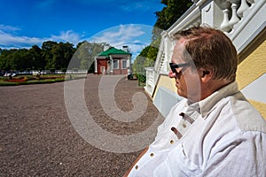 An elderly man resting in the city Park