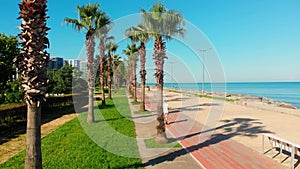 Elderly man run on cyclist lane in georgia Batumi beach in hot summer day with sea view. Travel and active health lifestyle