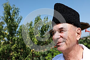 Elderly man in Russian Karakul Kubanka Cossack Hat