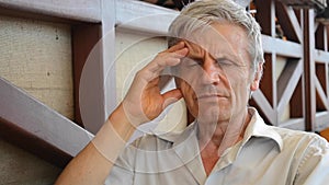 Elderly man serious think, reflects