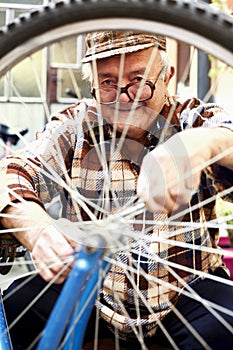 Elderly man serviced bikes