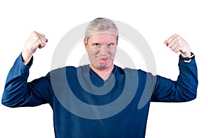Elderly man shows strength. Isolated on a white background