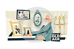 Elderly man sitting in chair and looking at photos