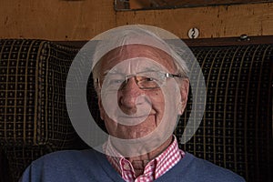 Elderly man smiles into camera
