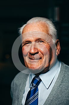 Elderly man smiling towards camera