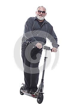 elderly man standing on electric scooter. isolated on a white