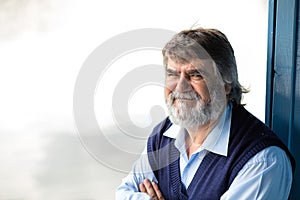 Elderly man standing outside