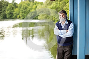 Elderly man standing outside