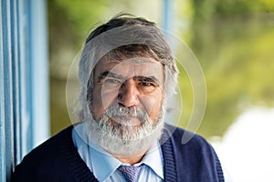 Elderly man standing outside