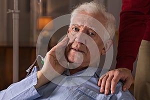 Elderly man suffering from dementia photo