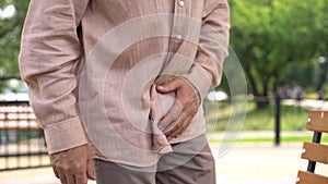 Elderly man suffering from prostate inflammation, sudden pain, mens health