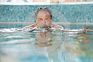 Elderly man at swimming pool