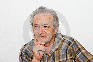 Elderly man with thoughtful expression