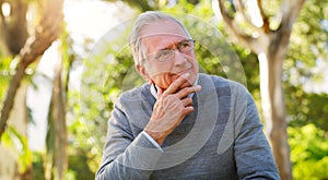 Elderly man, vision or thinking at a park, reflection or remember with nostalgia and choice for life extension treatment